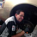 Senior Technician, Kelly Schultz, working on brake service	